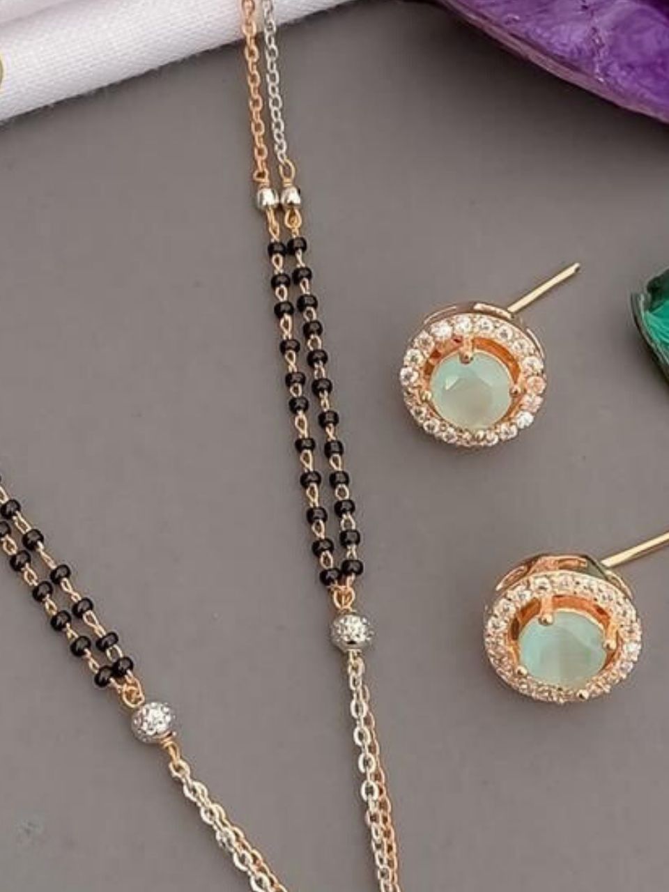 Rose Gold Plated Round Designer Mangalsutra Pended Set With Emerald Stones