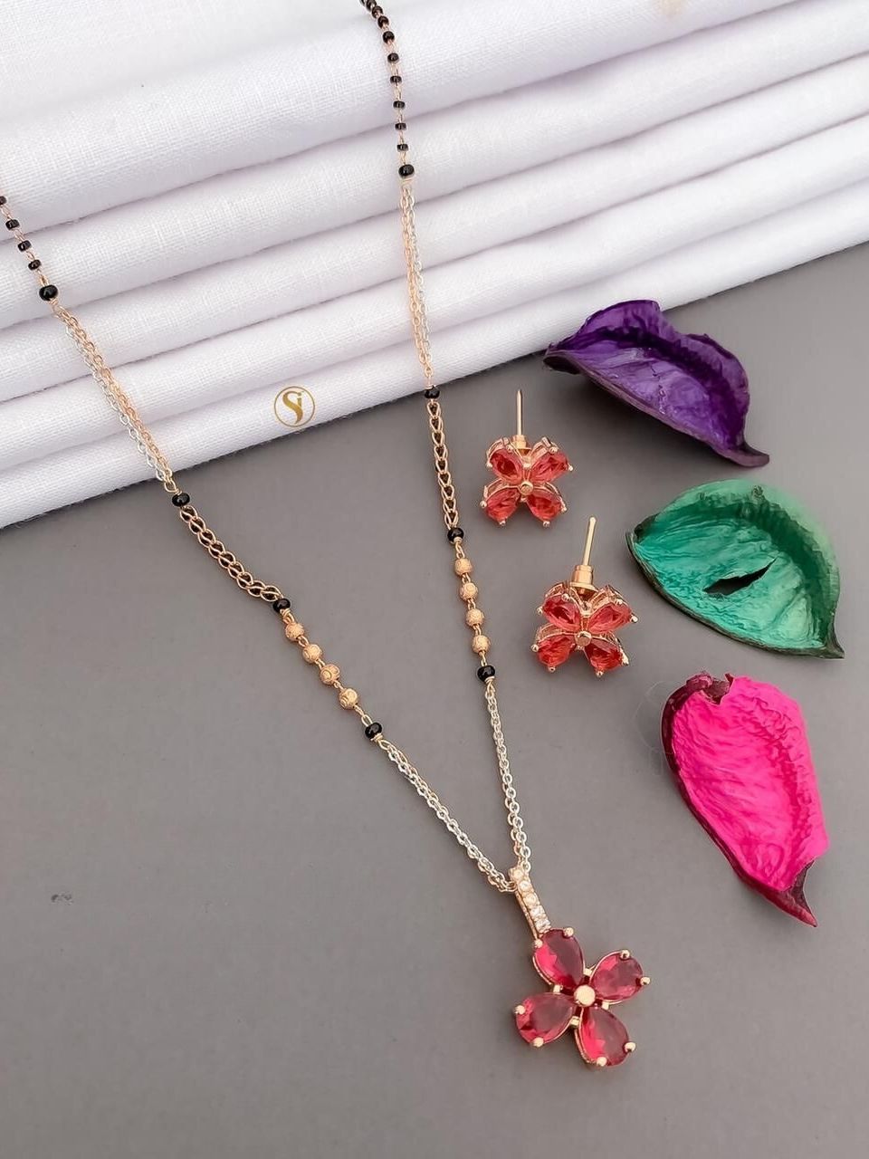 Rose Gold Plated Flower Designer Mangalsutra Pended Set With Emerald Stones